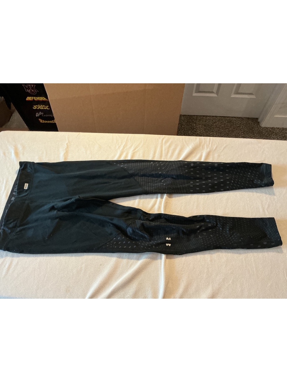 Under Armour black leggings with perforated lower legs